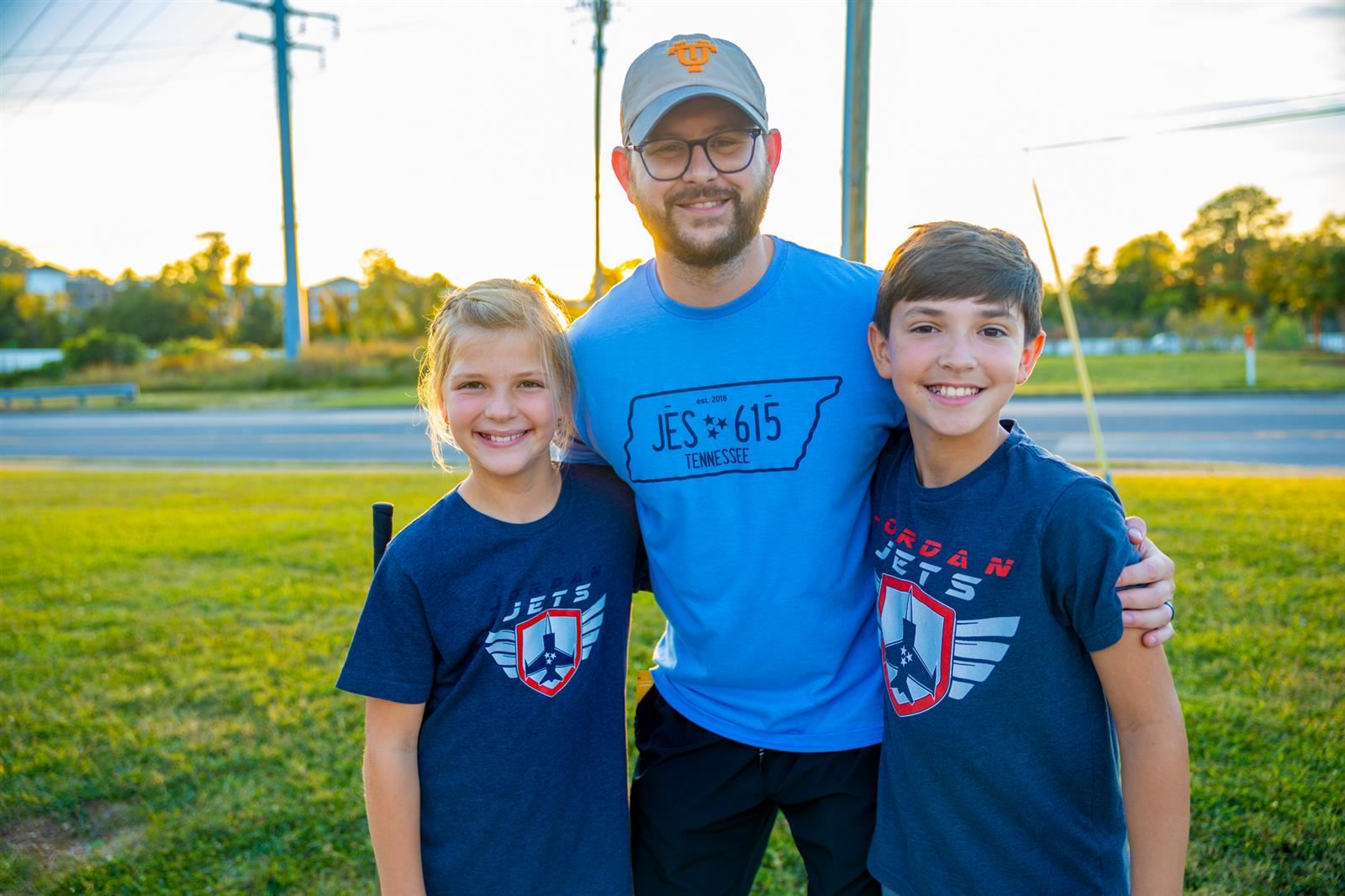vice principal and two students at mini golf